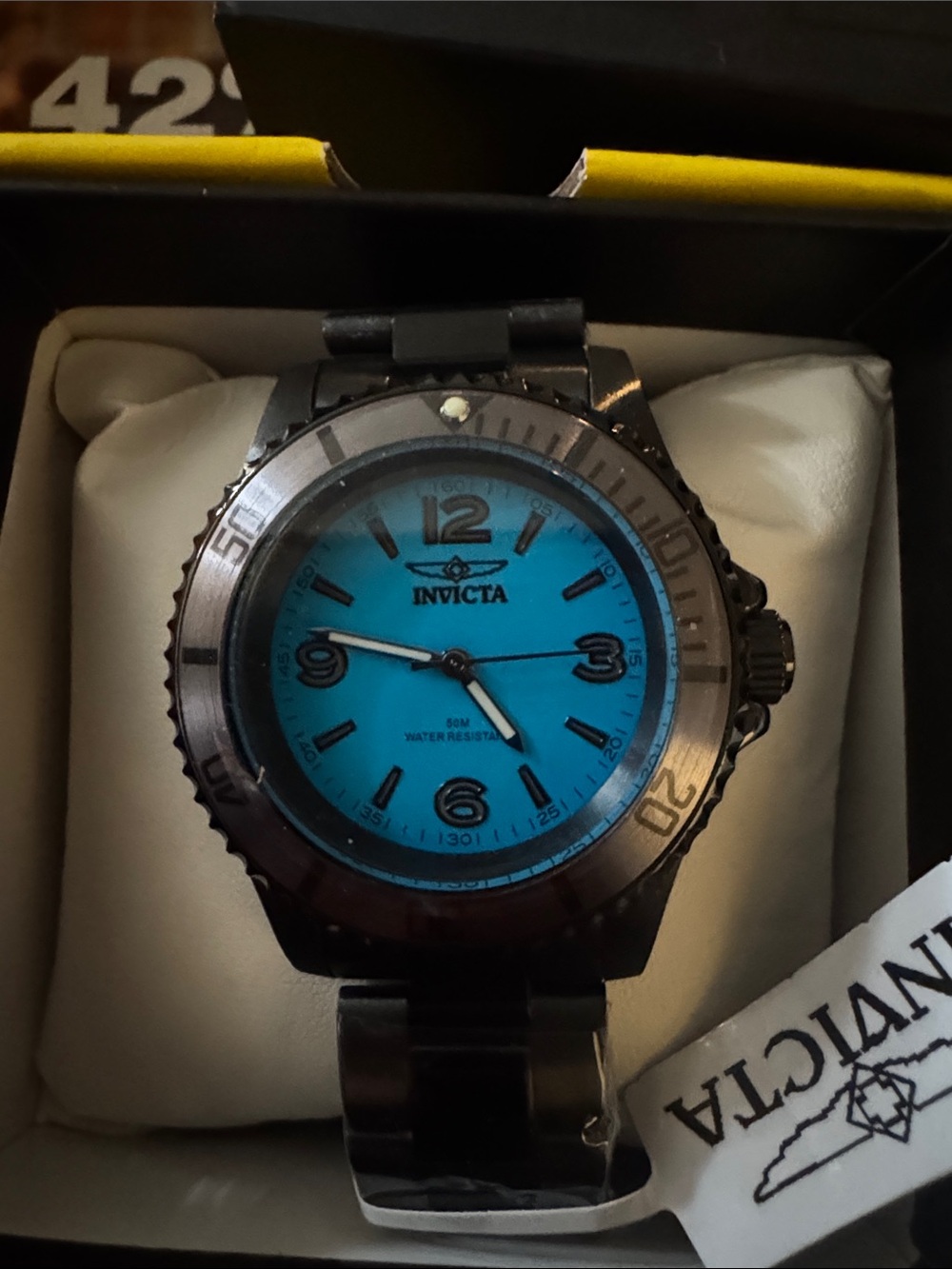 Invicta Black Watch with Turquoise Blue Dial